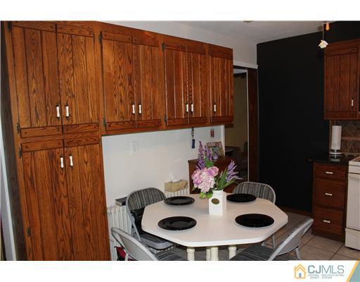 24 Old Post Road Edison, NJ 08817 - Photo 6 of 22 a kitchen with a sink and cabinets