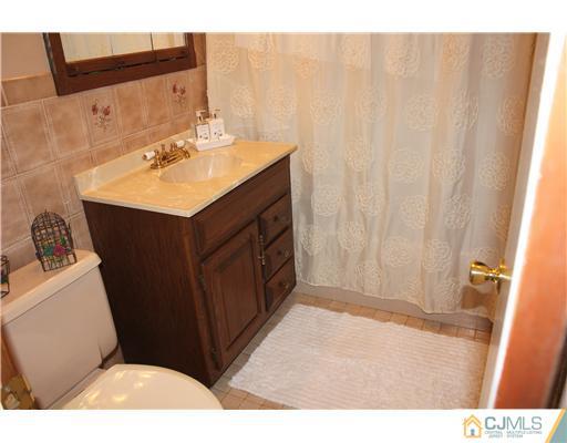 24 Old Post Road Edison, NJ 08817 - Photo 8 of 22 a bathroom with a sink vanity granite and toilet