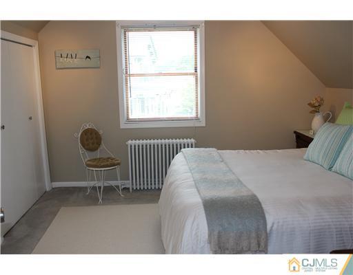 24 Old Post Road Edison, NJ 08817 - Photo 10 of 22 a bedroom with a bed a window and walk in closet