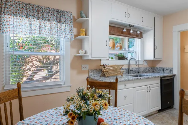 a bathroom with a sink a vanity and a large mirror