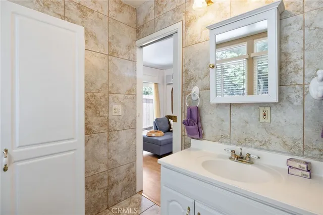 a bathroom with a sink and a mirror