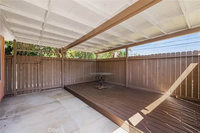 a bench sitting in a room next to a yard