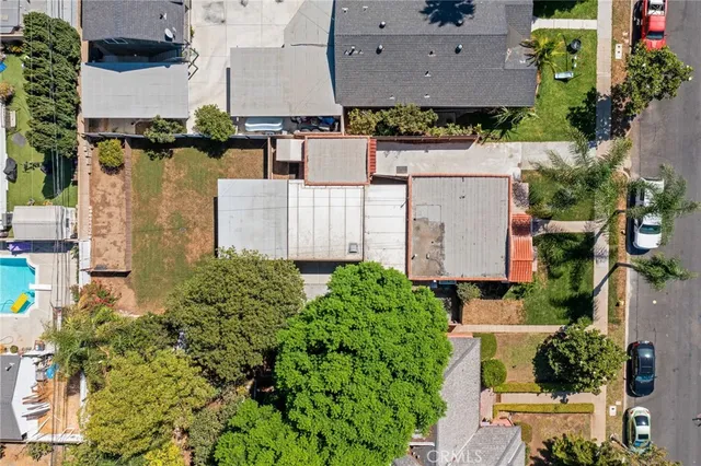 an aerial view of a house with outdoor space