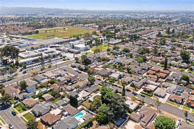 an aerial view of a city with a lake