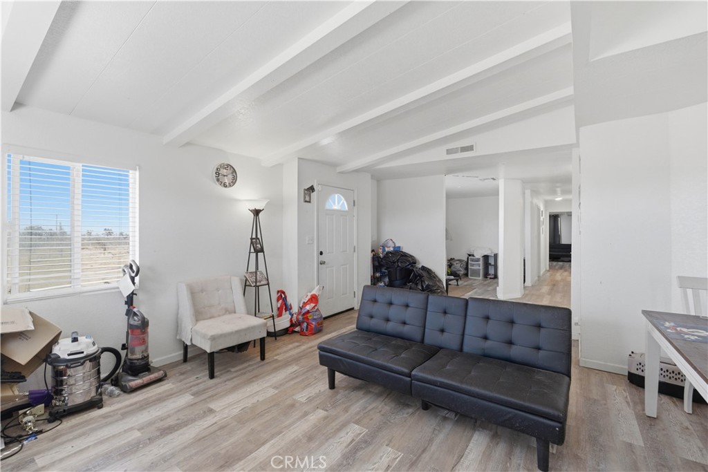 5885 Dos Palmas Road Phelan, CA 92371 - Photo 7 of 40 a living room with furniture and a wooden floor