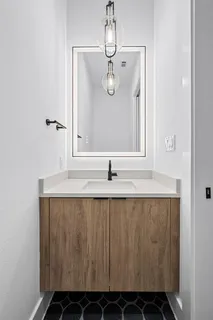 a bed room with a bed and a chandelier