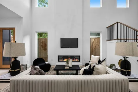 a view of room with window and ceiling fan