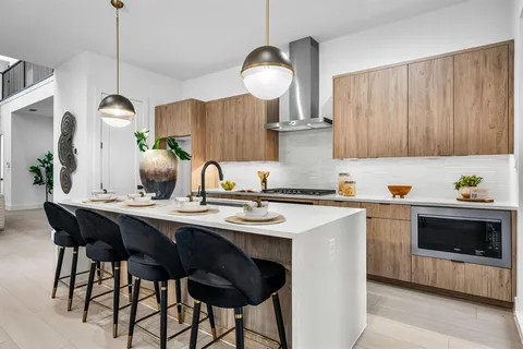 a kitchen with a sink cabinets and window
