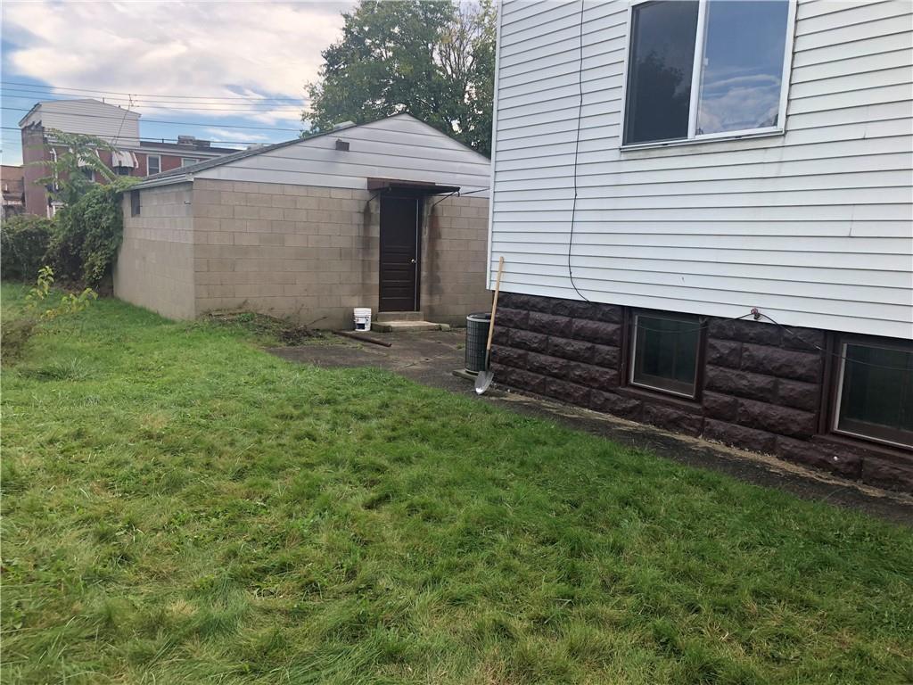 1141 9th Street McKees Rocks, PA 15136 - Photo 9 of 21 a front view of a house with a garden