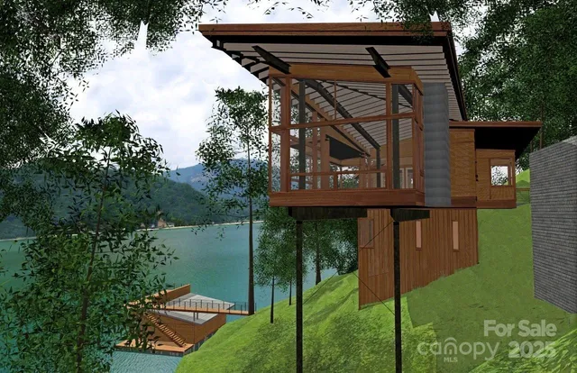 a backyard of a house with lots of green space and lake view