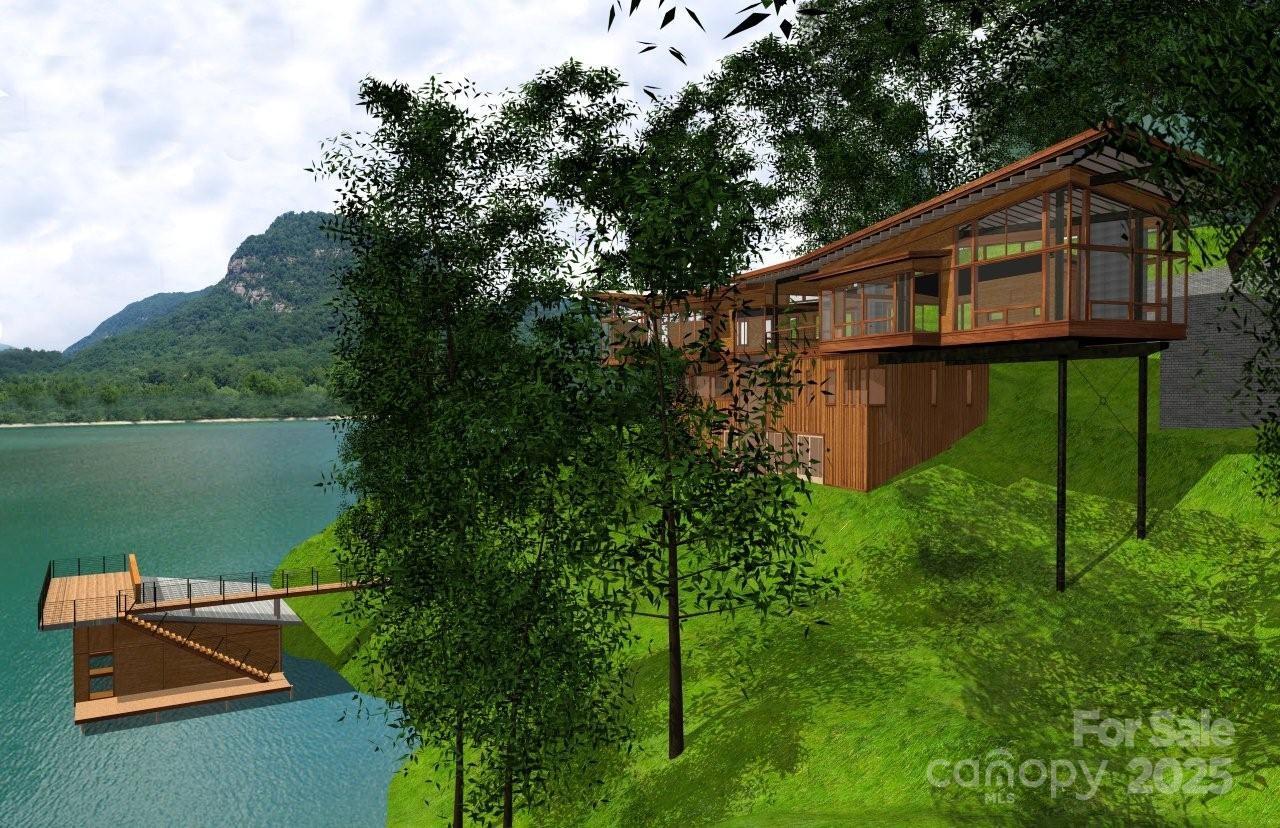 0 Chapel Point Road, Unit 14 Lake Lure, NC 28746 - Photo 7 of 12 a backyard of a house with lots of green space and lake view