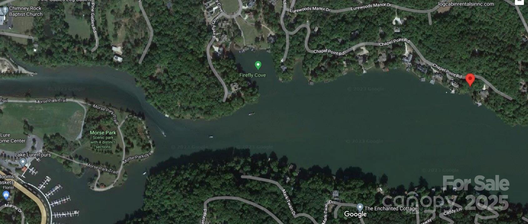 0 Chapel Point Road, Unit 14 Lake Lure, NC 28746 - Photo 9 of 12 a view of a lake and a yard