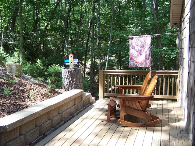 355 Trout Lake Road Deep Gap, NC 28618 - Photo 18 of 45 a balcony with wooden floor table and chairs