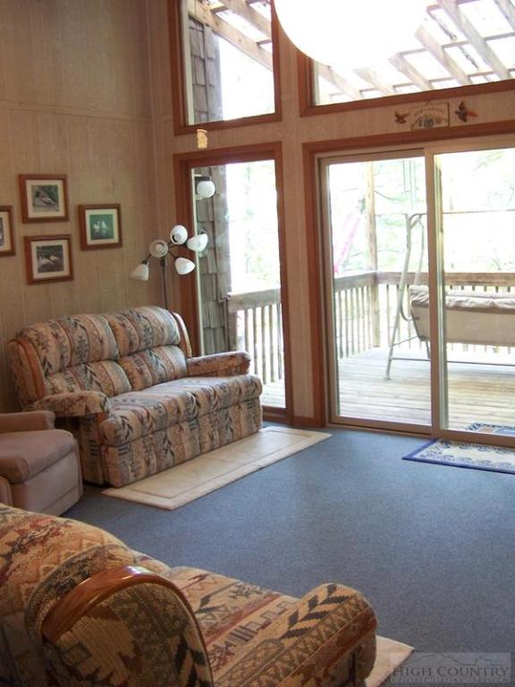 355 Trout Lake Road Deep Gap, NC 28618 - Photo 29 of 45 a living room with furniture and a large window