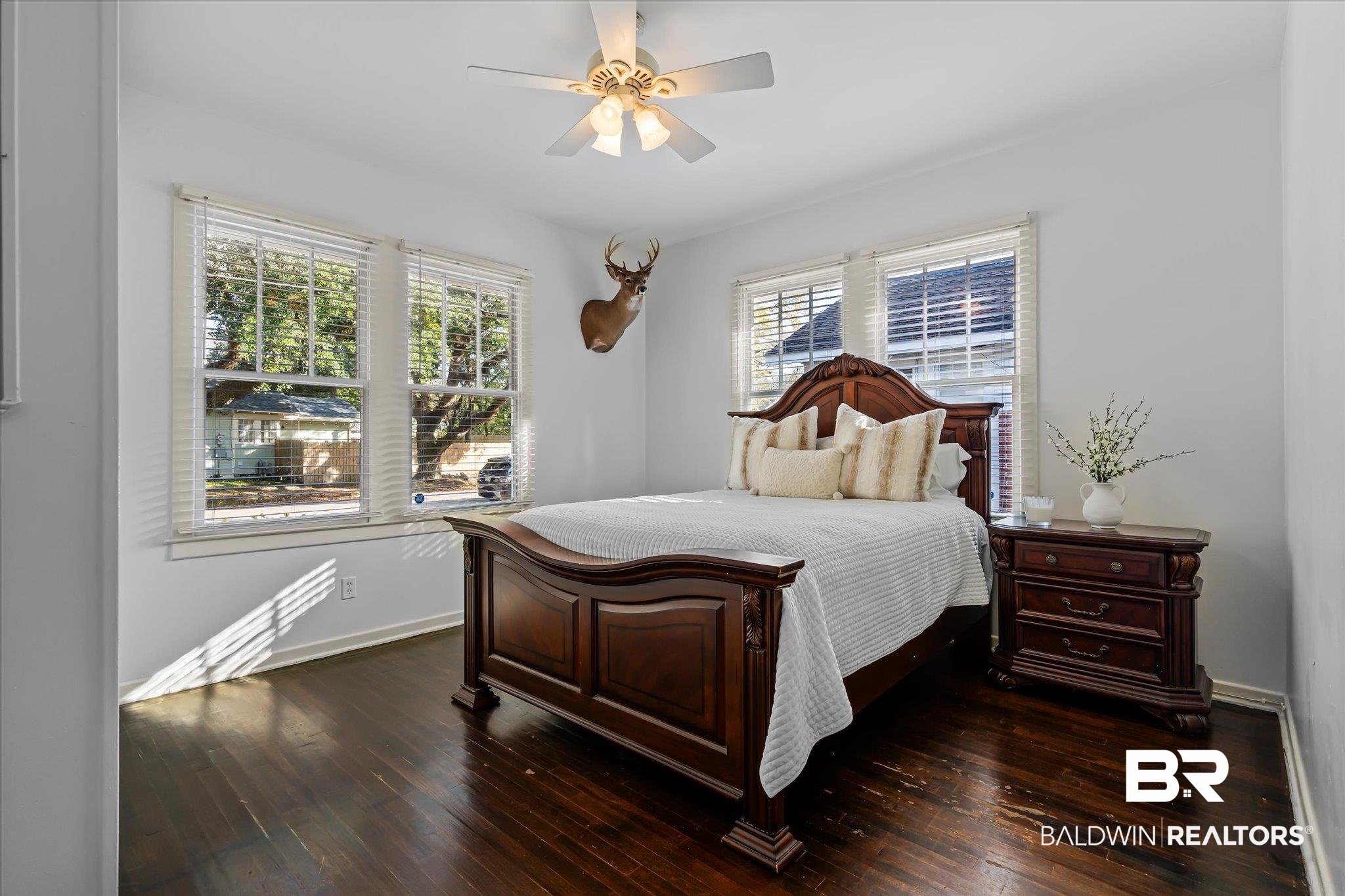 180 Williams Street Mobile, AL 36606 - Photo 14 of 20 Bedroom featuring ceiling fan, dark hardwood / wood-style floors, and multiple windows