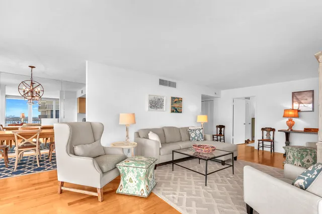 a living room with furniture and a table