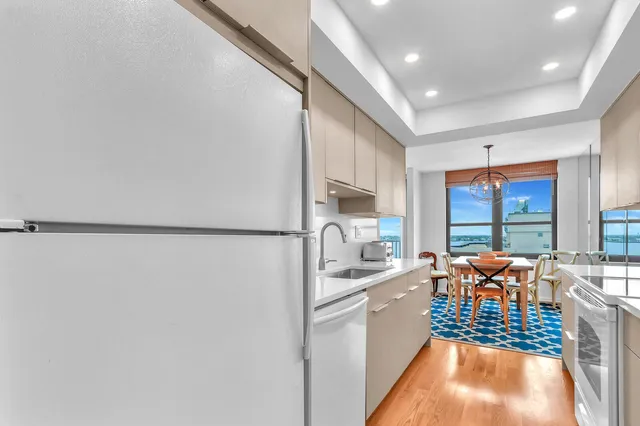 a large white kitchen with lots of counter top space