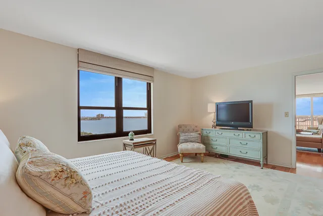 a bedroom with a bed and a television in it