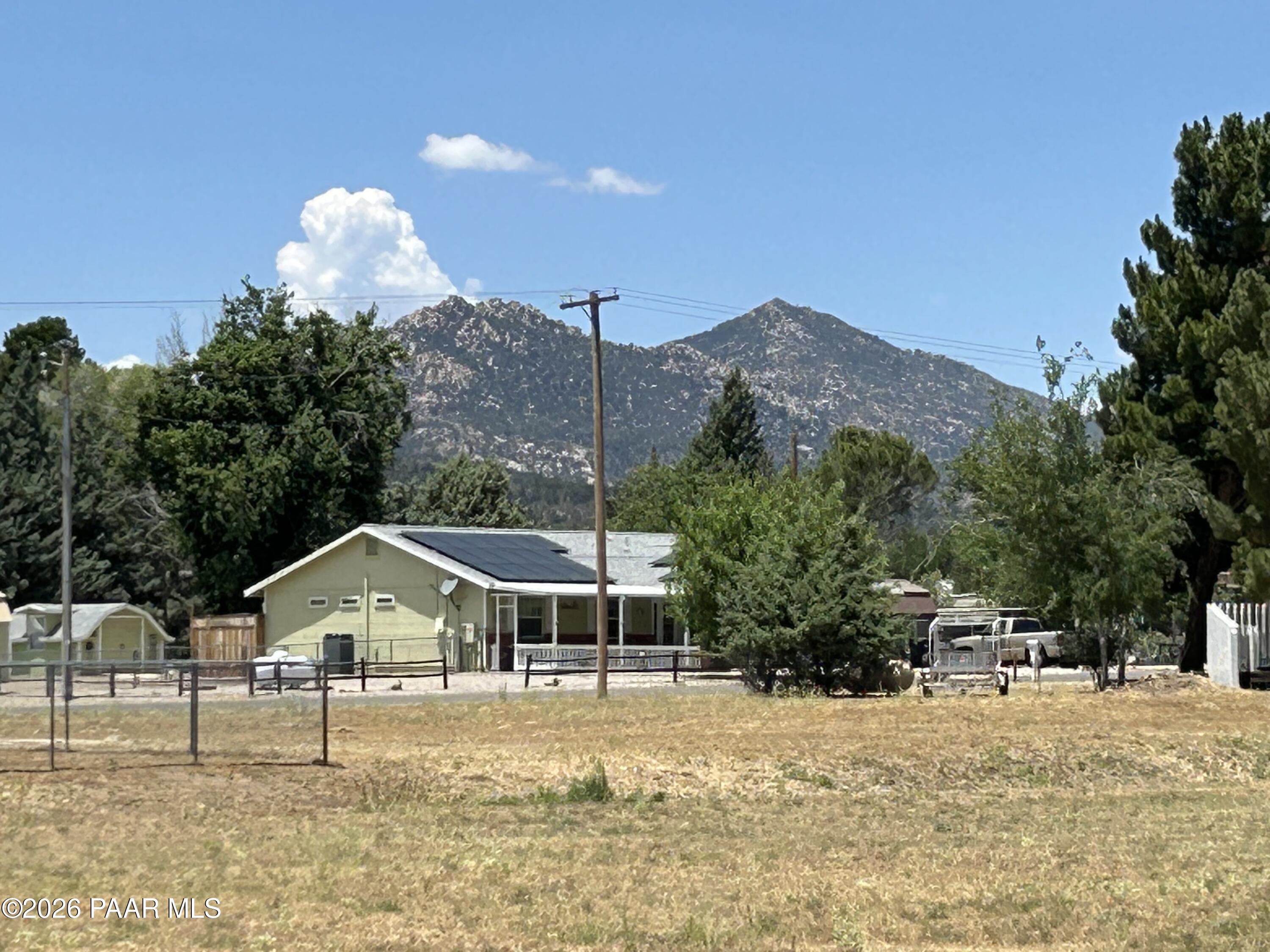 18628 Joseph Hodge Road Peeples Valley, AZ 86332 - Photo 4 of 18 a house with trees in the background