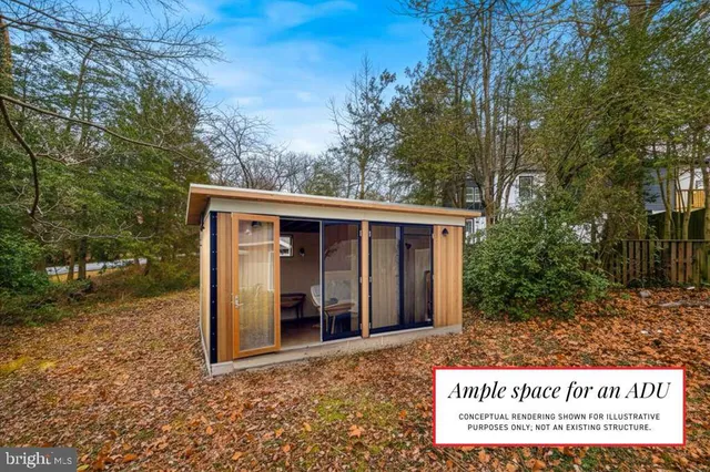 a front view of house with a garden