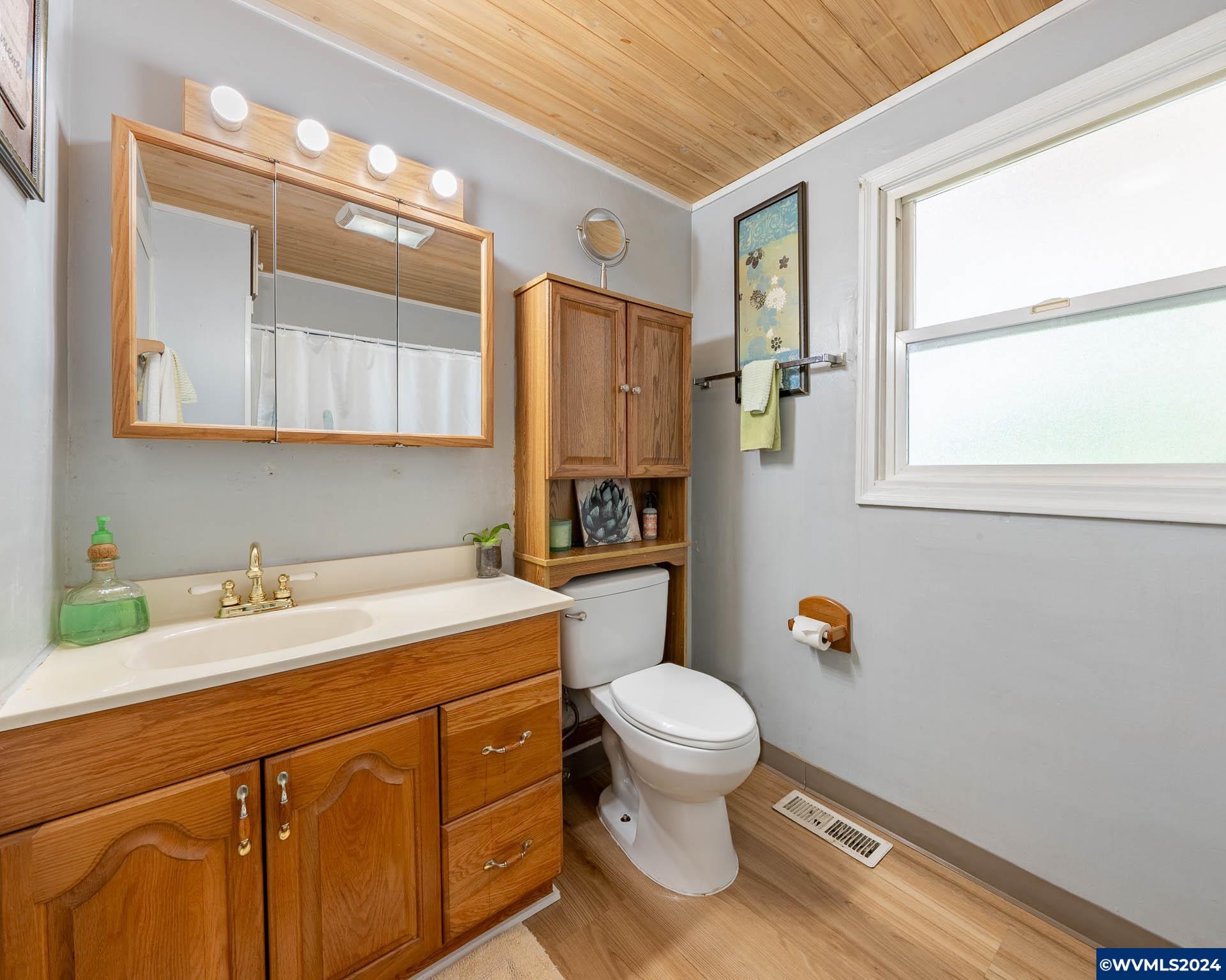 1530 2nd Avenue Albany, OR 97321 - Photo 18 of 35 a bathroom with a sink toilet and a mirror