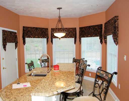 16 Renaissance Drive Irwin, PA 15642 - Photo 16 of 18 Kitchen. oversized island with attached granite table, truly a kitchen you would gather in.