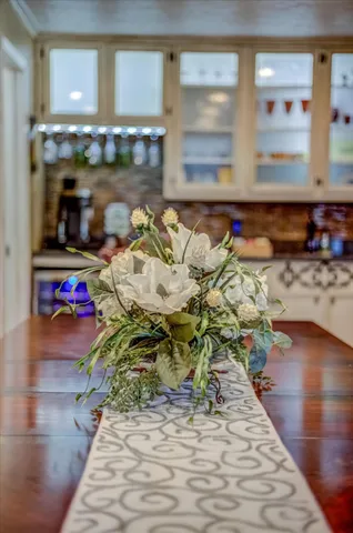 a kitchen with granite countertop a stove and a cabinets