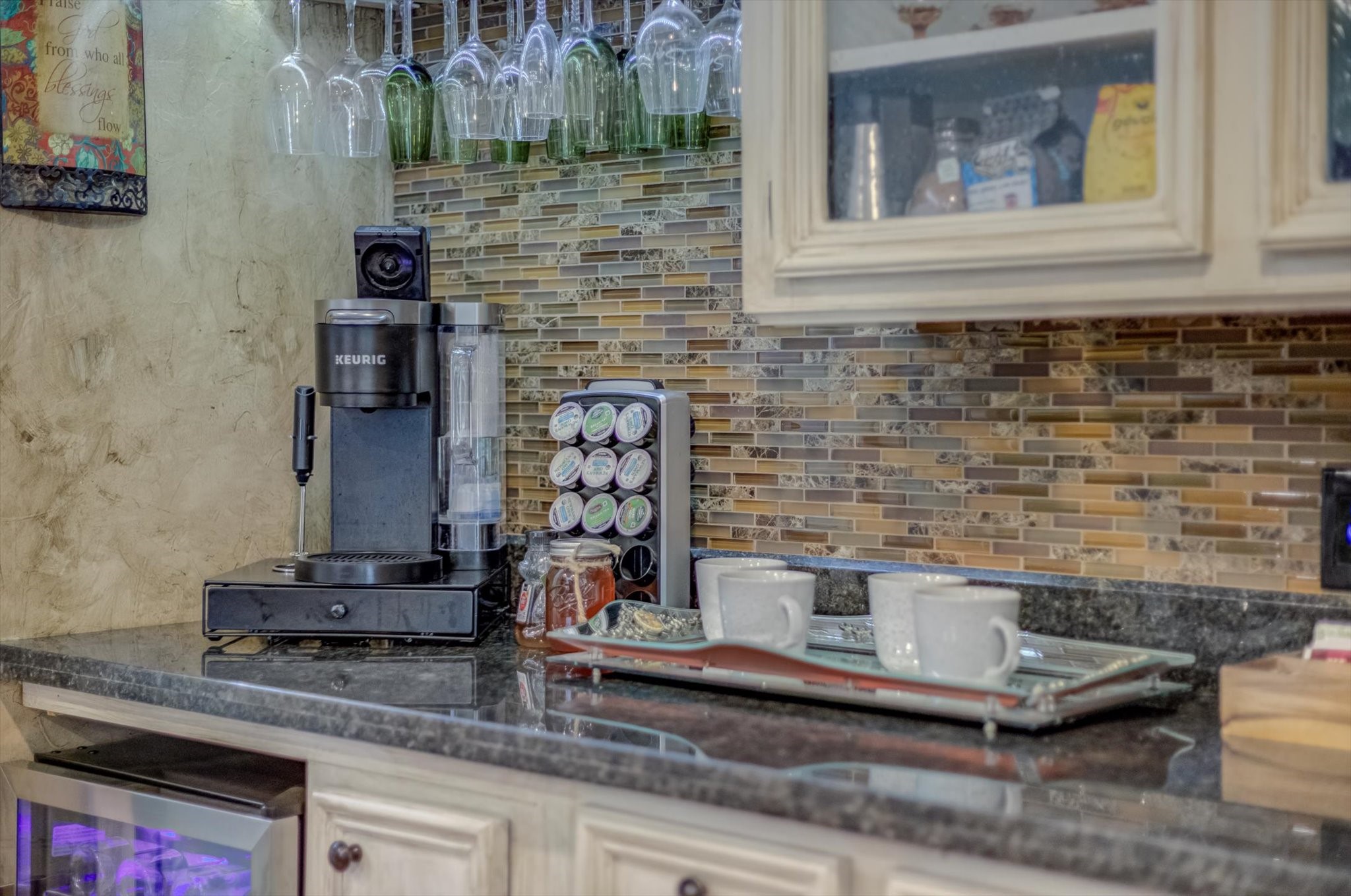 22 Winged Foot Drive Conroe, TX 77304 - Photo 20 of 49 a kitchen with granite countertop a stove and a cabinets