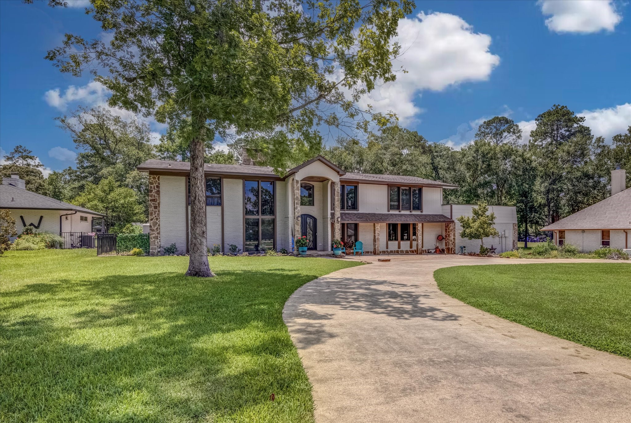 22 Winged Foot Drive Conroe, TX 77304 - Photo 3 of 49 a front view of a house with a yard