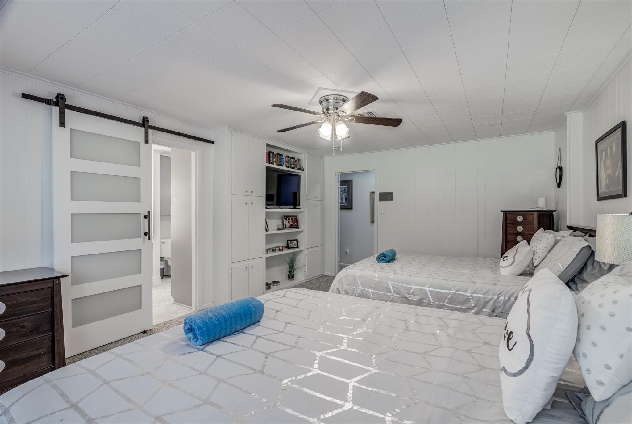 22 Winged Foot Drive Conroe, TX 77304 - Photo 32 of 49 a bedroom with a bed and cabinets