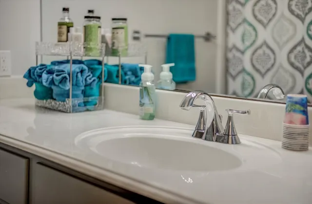 a bathroom with a sink and mirror