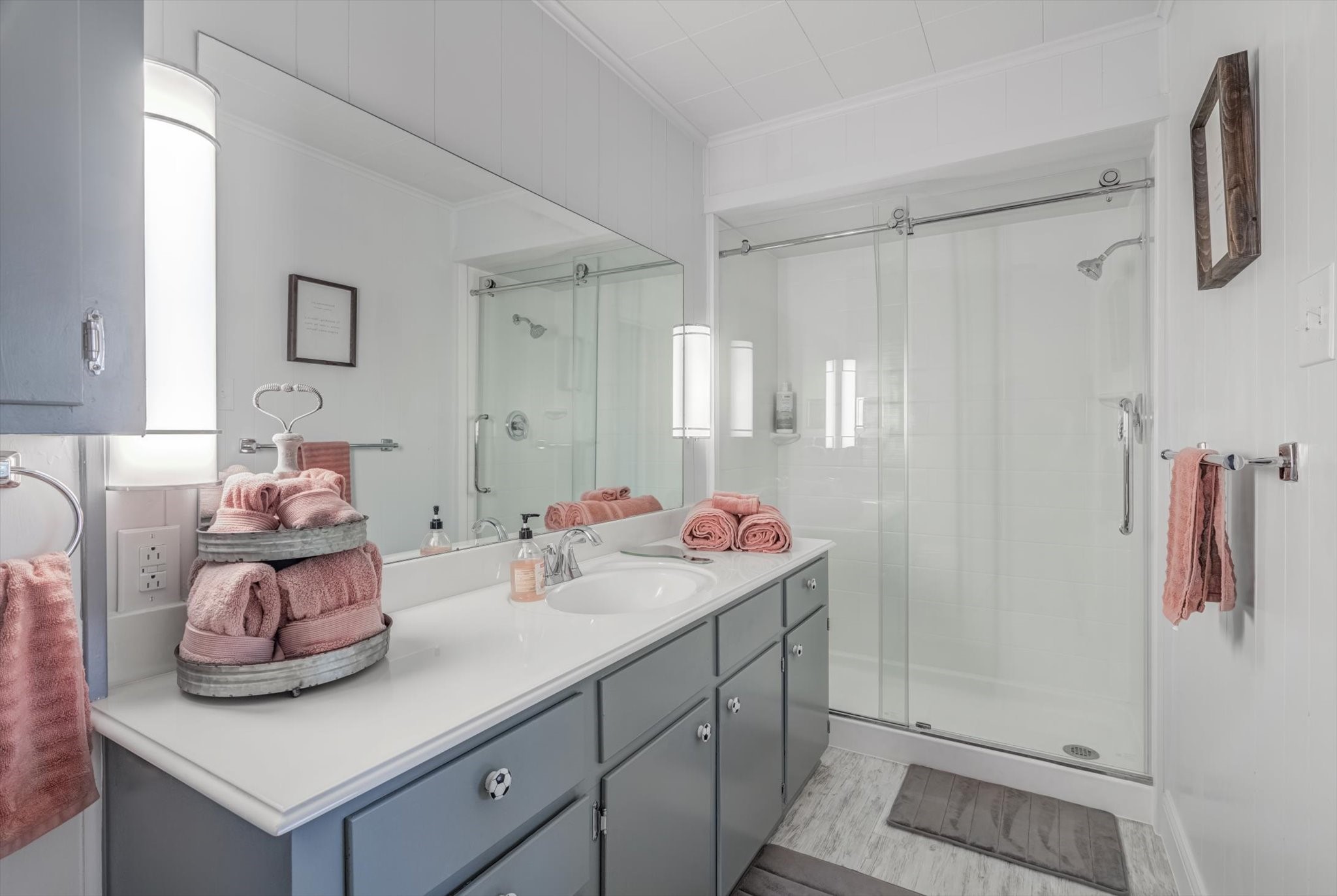 22 Winged Foot Drive Conroe, TX 77304 - Photo 40 of 49 a bathroom with a sink vanity and mirror