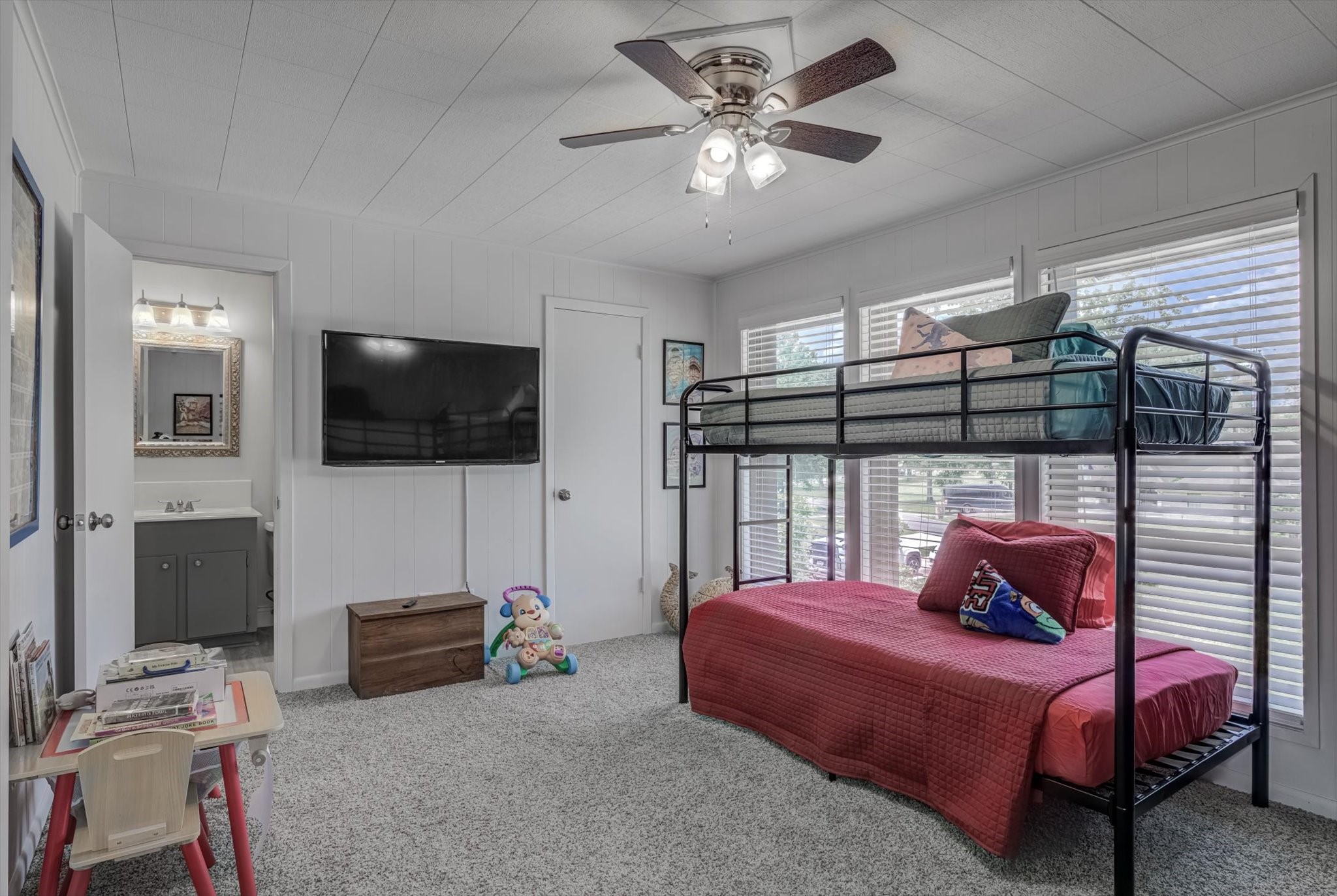 22 Winged Foot Drive Conroe, TX 77304 - Photo 41 of 49 a bedroom with a bed and a flat screen tv