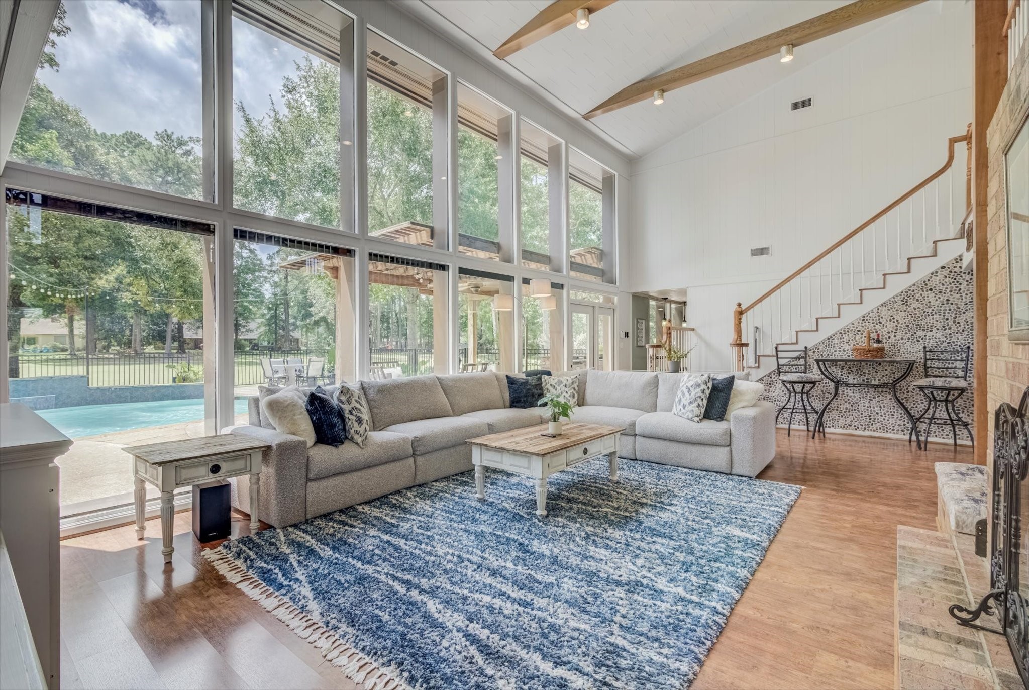 22 Winged Foot Drive Conroe, TX 77304 - Photo 5 of 49 a living room with large windows next to a large window