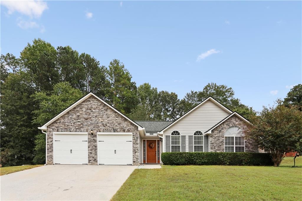 302 Silverleaf Lane Dallas, GA 30157 - Photo 1 of 1 a view of a house with a yard