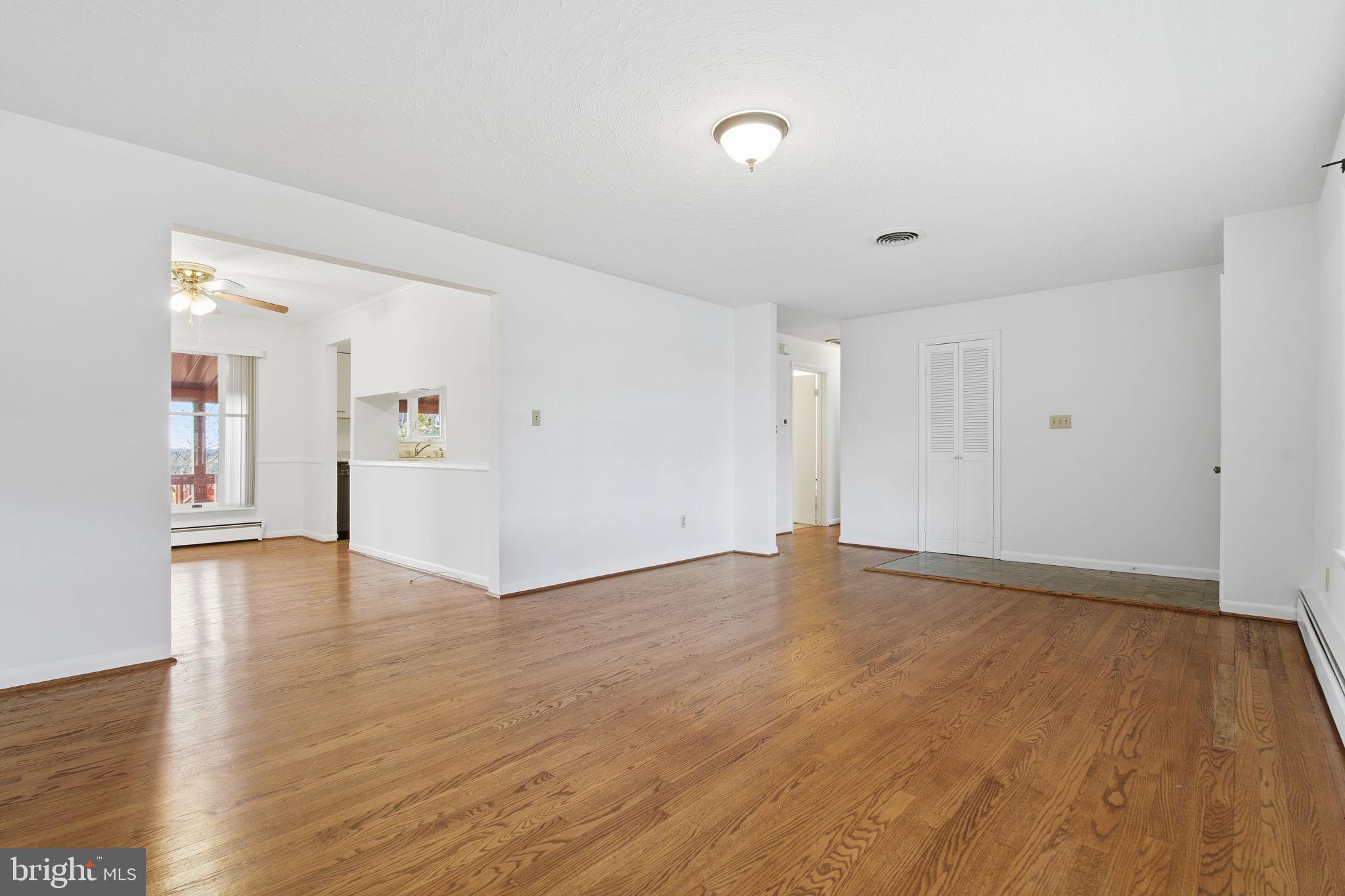 4008 Rock Run Road Havre de Grace, MD 21078 - Photo 11 of 28 a view of an empty room with wooden floor and a cabinet