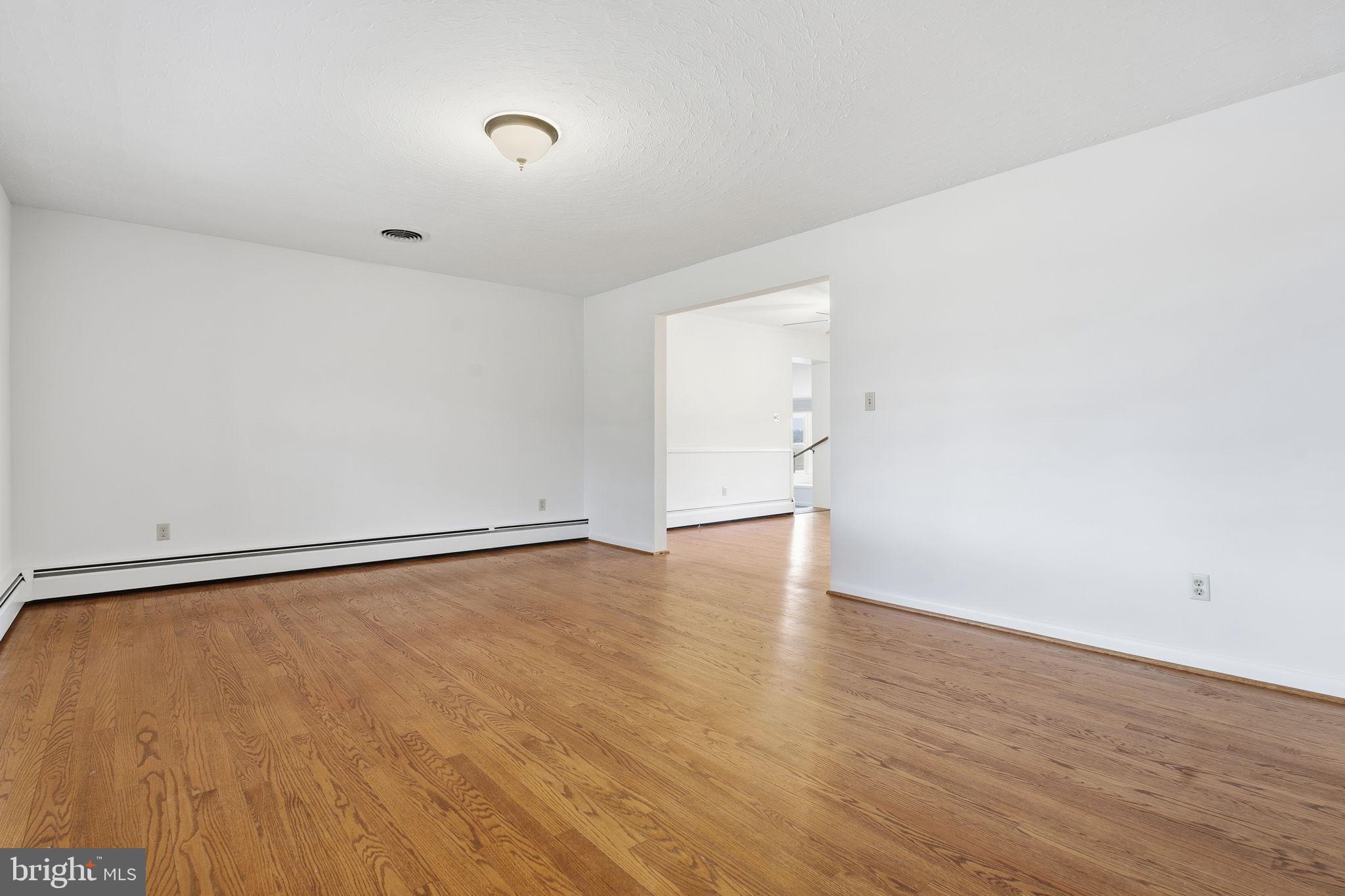 4008 Rock Run Road Havre de Grace, MD 21078 - Photo 12 of 28 a view of an empty room with wooden floor