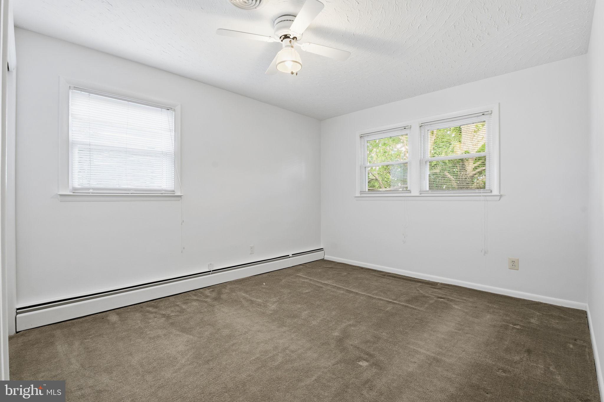 4008 Rock Run Road Havre de Grace, MD 21078 - Photo 17 of 28 an empty room with windows and fan