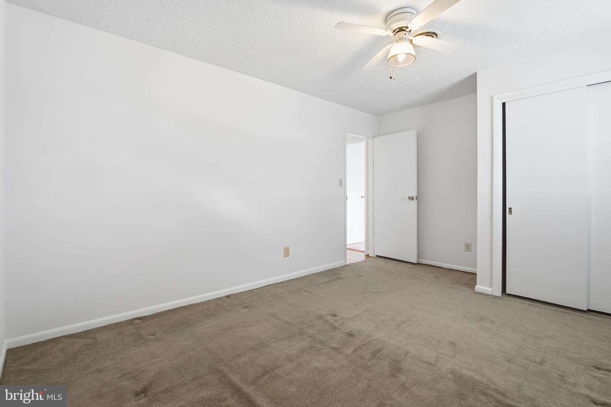 4008 Rock Run Road Havre de Grace, MD 21078 - Photo 18 of 28 an empty room with closet and a chandelier fan