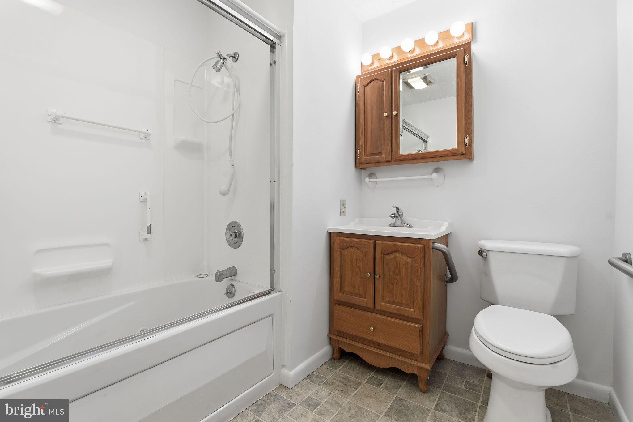 4008 Rock Run Road Havre de Grace, MD 21078 - Photo 19 of 28 a bathroom with a toilet a sink and bathtub