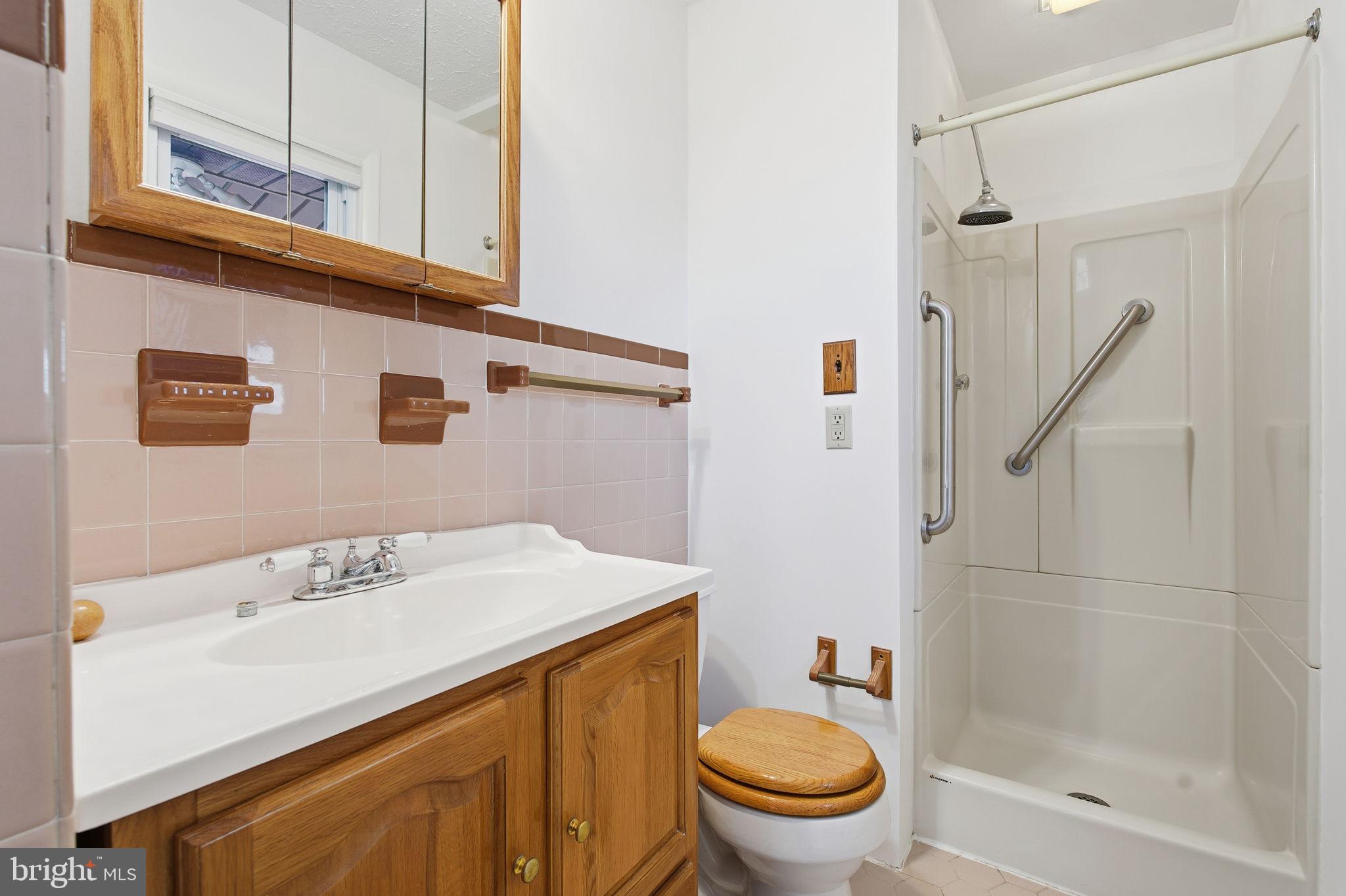 4008 Rock Run Road Havre de Grace, MD 21078 - Photo 20 of 28 a bathroom with a sink a toilet and shower