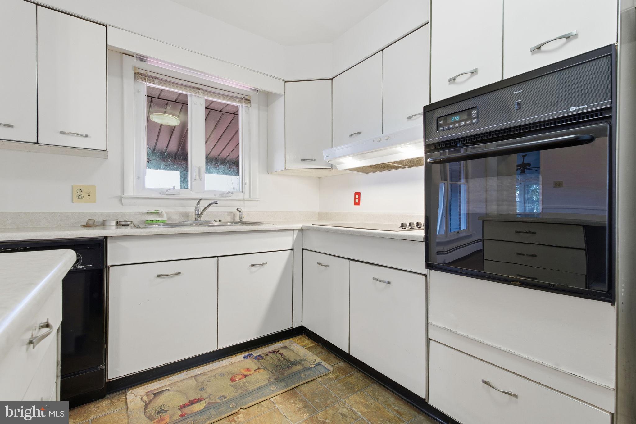 4008 Rock Run Road Havre de Grace, MD 21078 - Photo 4 of 28 a kitchen with granite countertop white cabinets and white appliances