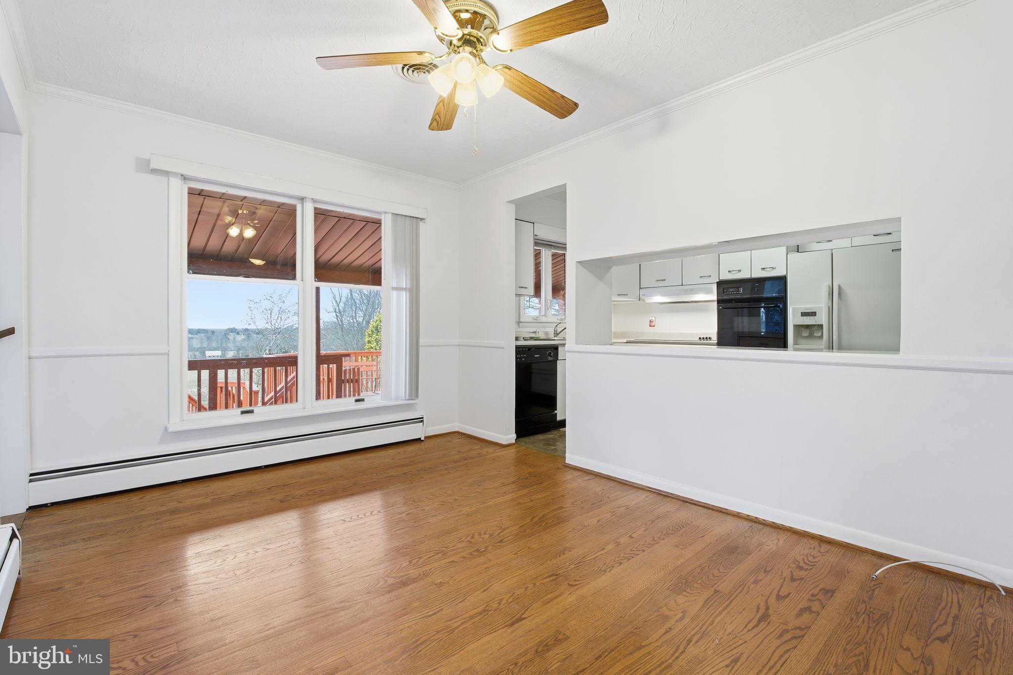 4008 Rock Run Road Havre de Grace, MD 21078 - Photo 9 of 28 a view of an empty room with window and wooden floor
