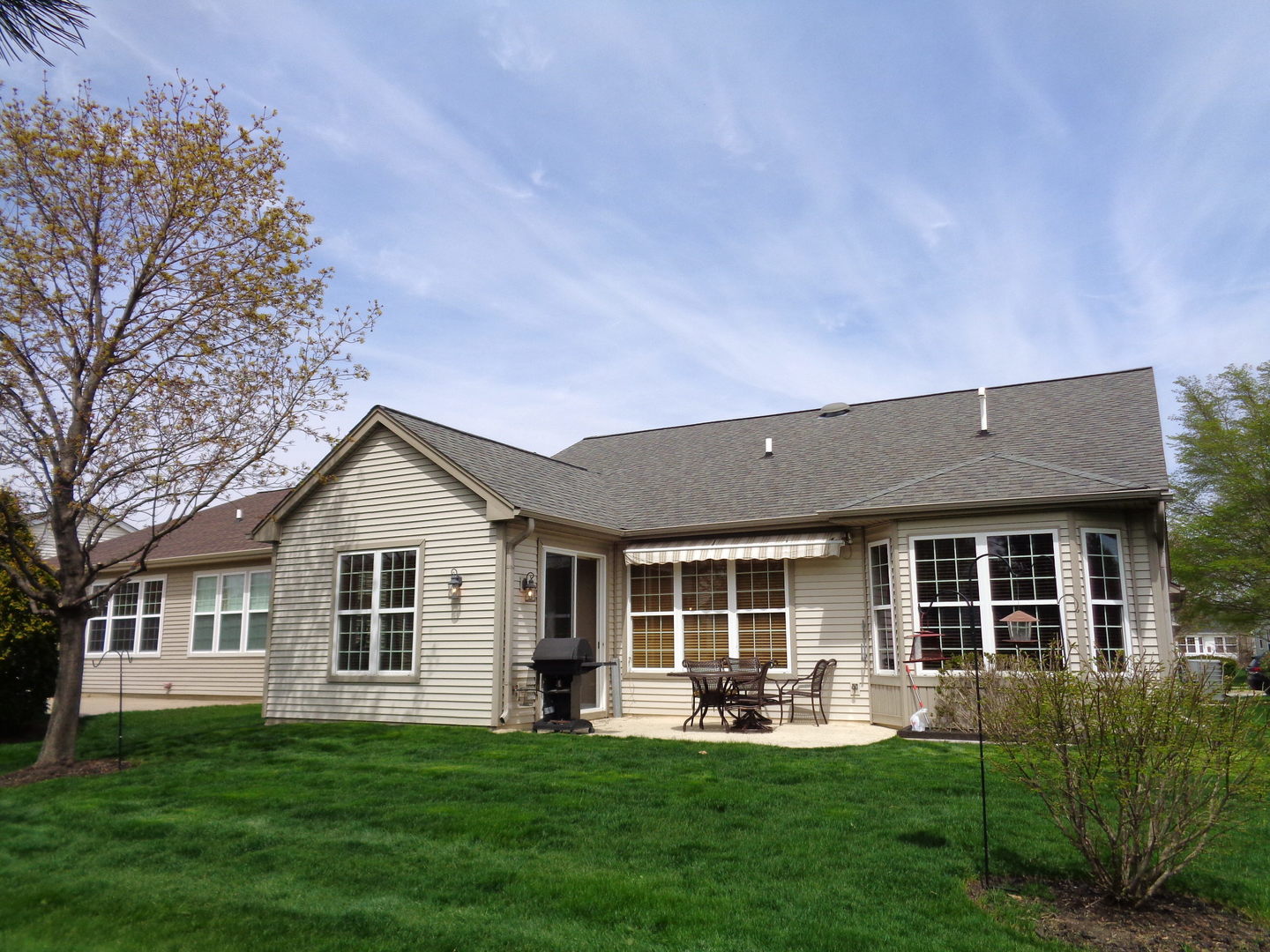 2521 Rolling Ridge Elgin, IL 60124 - Photo 2 of 16 a front view of a house with a yard and porch