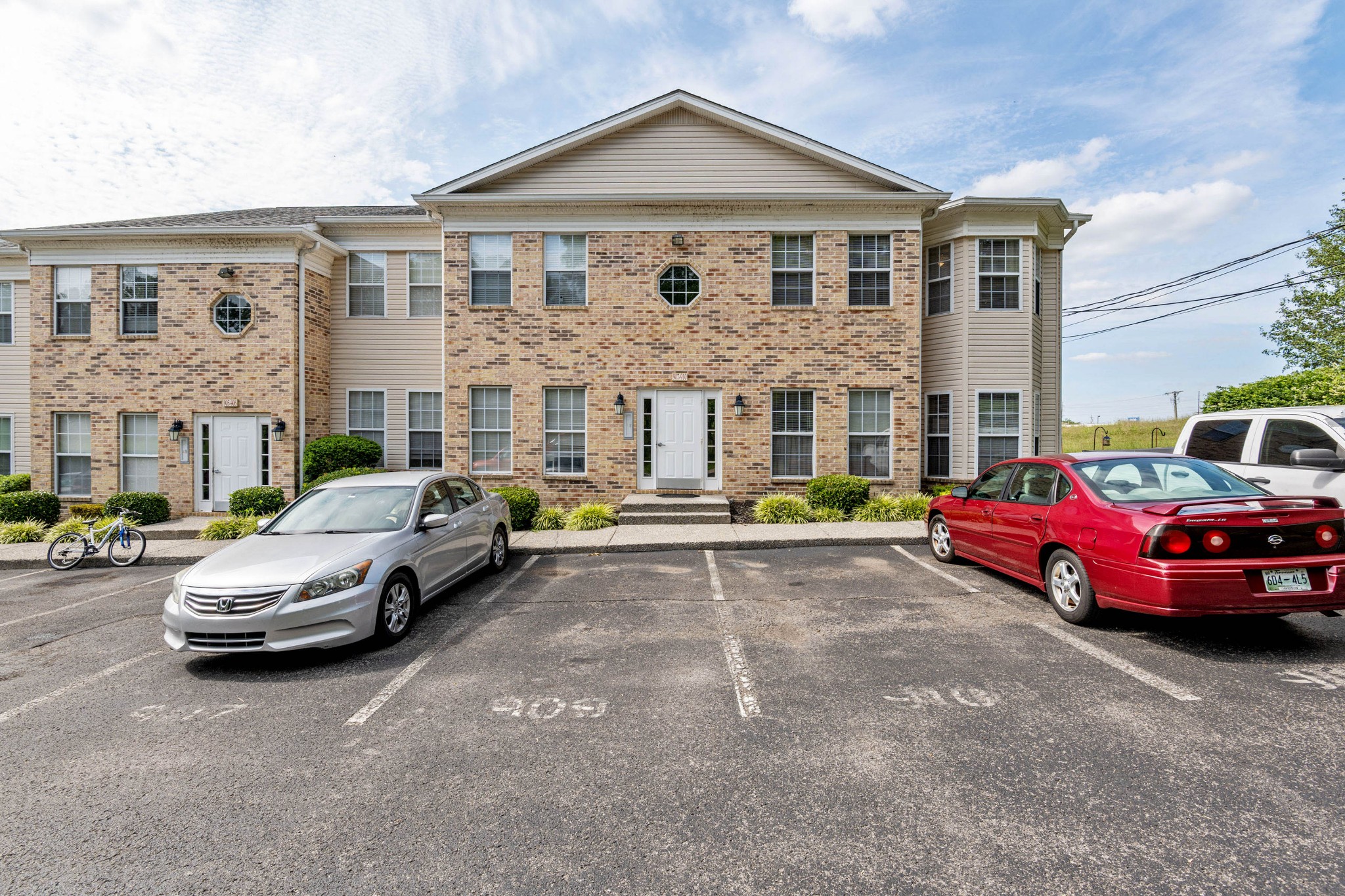 a front view of a house with parking space