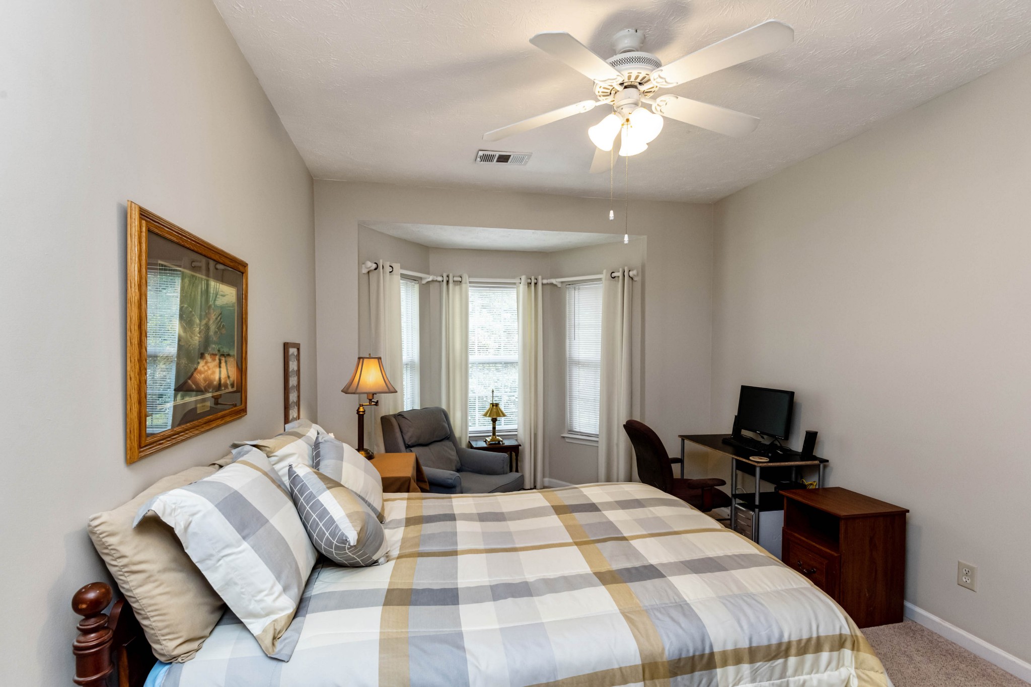 910 Churchill Crossing Madison, TN 37115 - Photo 16 of 25 a bedroom with a bed and wooden floor