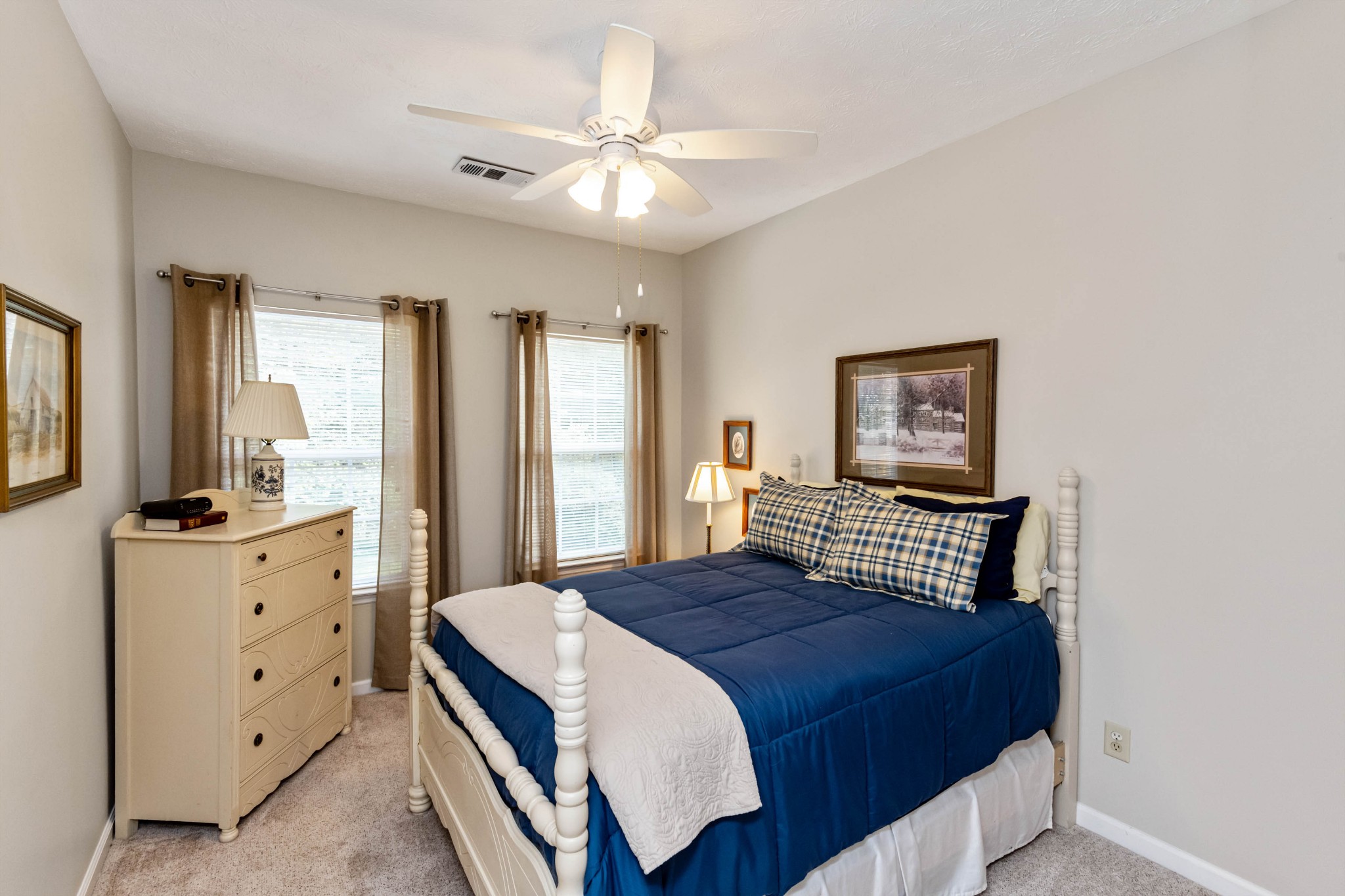 910 Churchill Crossing Madison, TN 37115 - Photo 19 of 25 a bedroom with a bed and a dresser