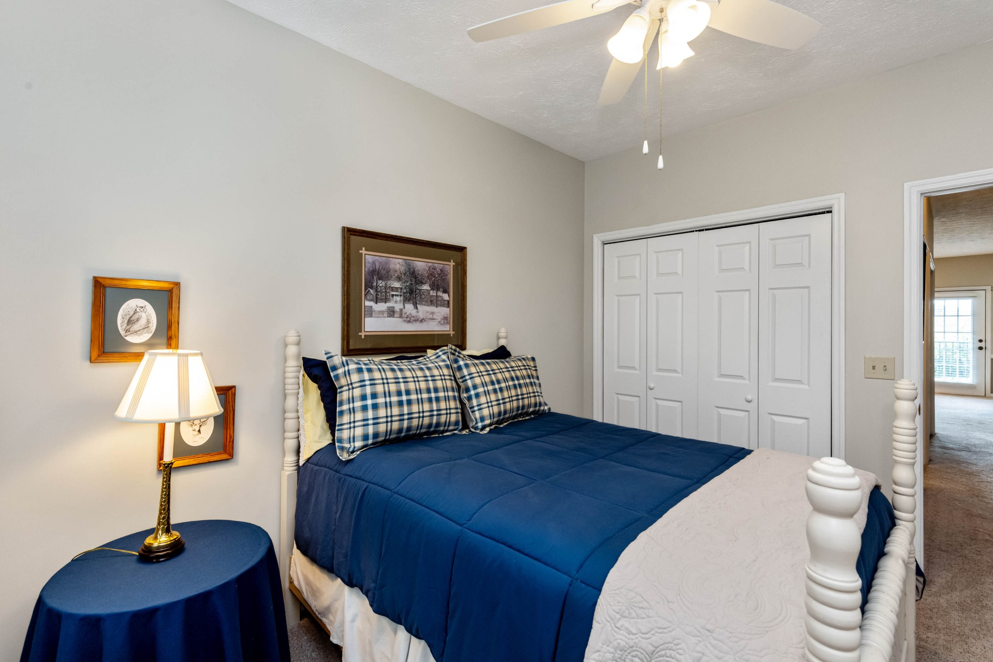 910 Churchill Crossing Madison, TN 37115 - Photo 20 of 25 a bedroom with a bed and a lamp on table