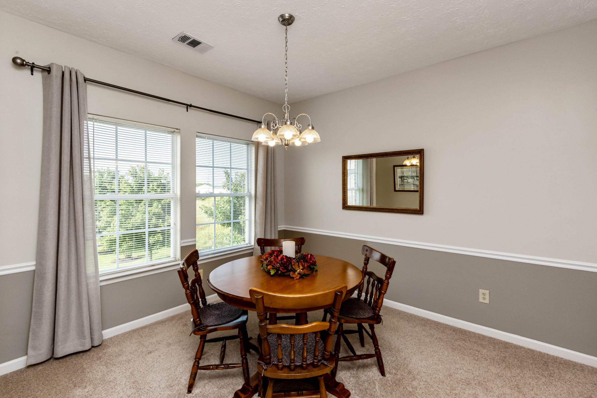 910 Churchill Crossing Madison, TN 37115 - Photo 5 of 25 a dining room with furniture a window and a chandelier