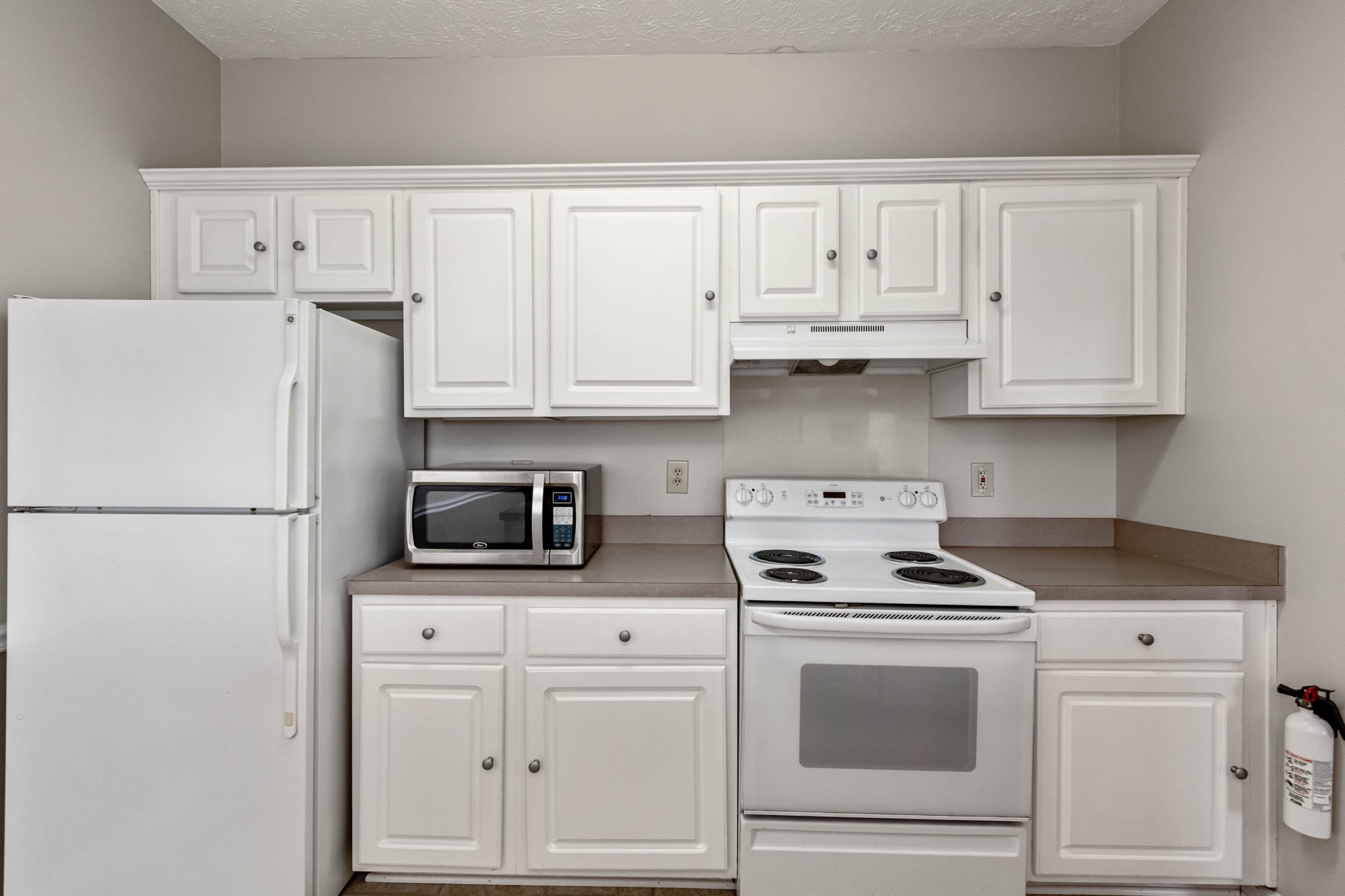 910 Churchill Crossing Madison, TN 37115 - Photo 9 of 25 a white refrigerator freezer and white cabinets